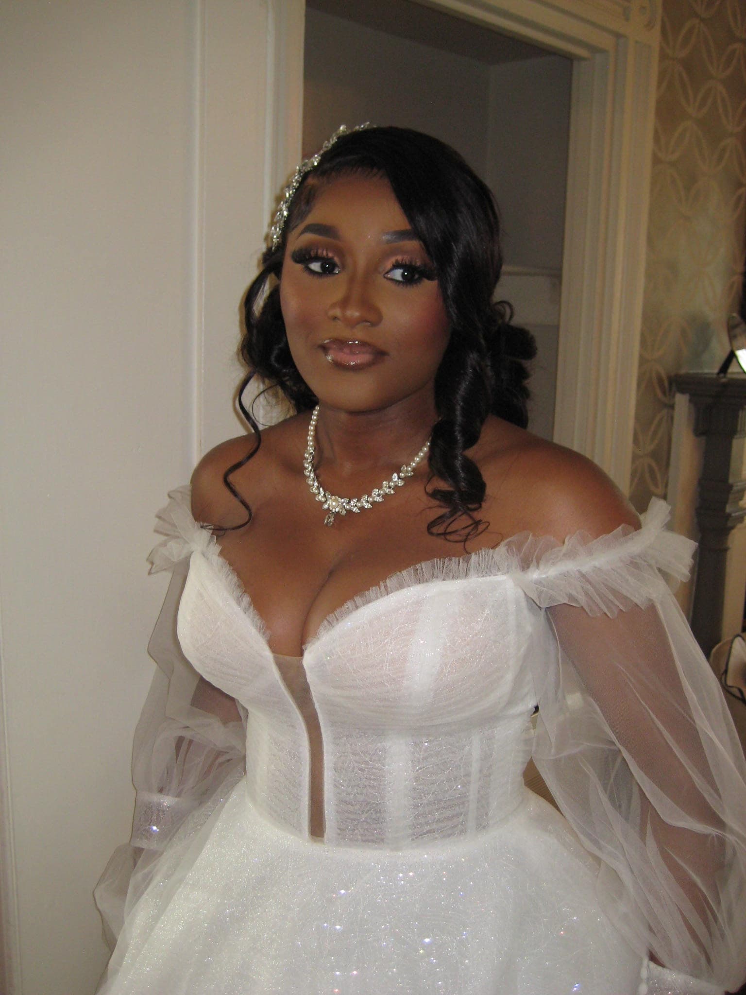Ekemini on her wedding day, in an ivory gown.
